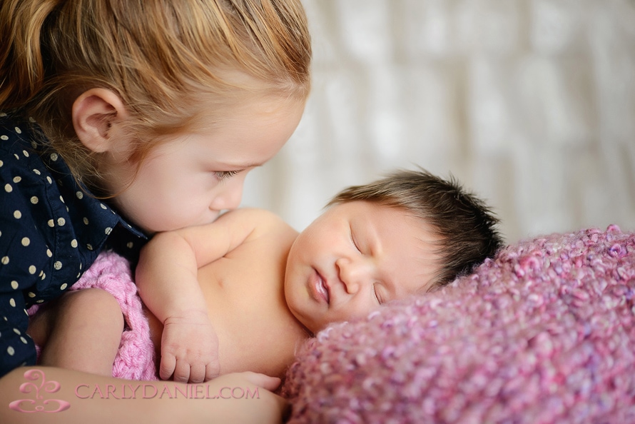 newborn baby with sister