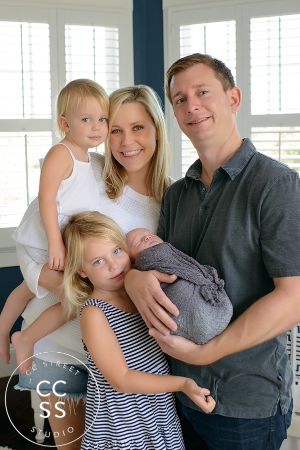 newborn with family photo